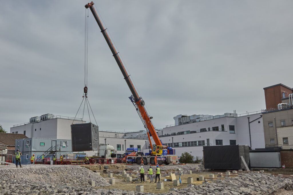 A module is lifted into place at RUH, Bath
