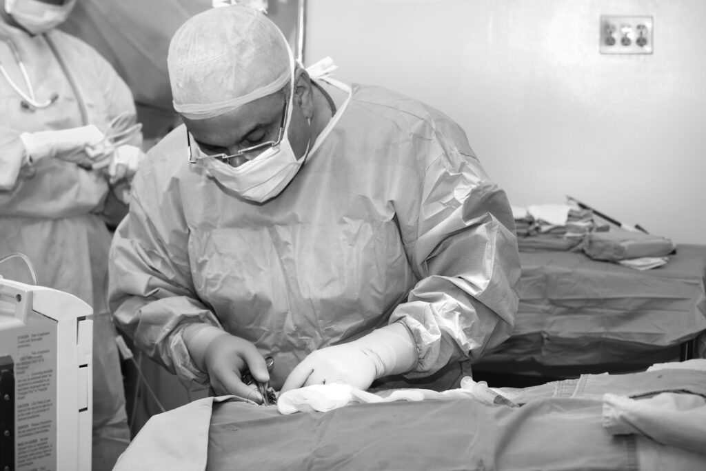 Consultant conducts surgery in mobile theatre unit